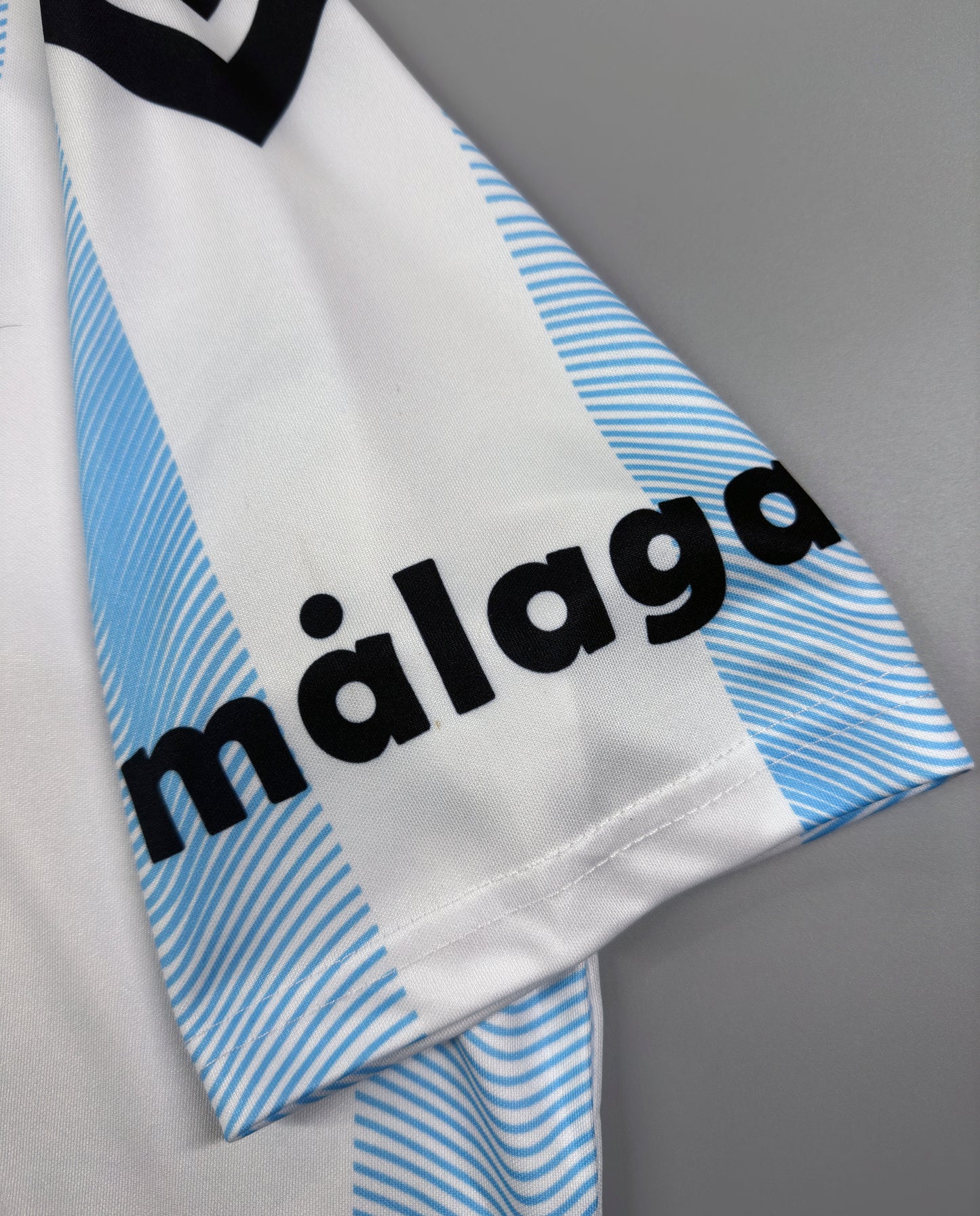 CAMISETA PRIMERA EQUIPACIÓN MÁLAGA 23/24 VERSIÓN FAN