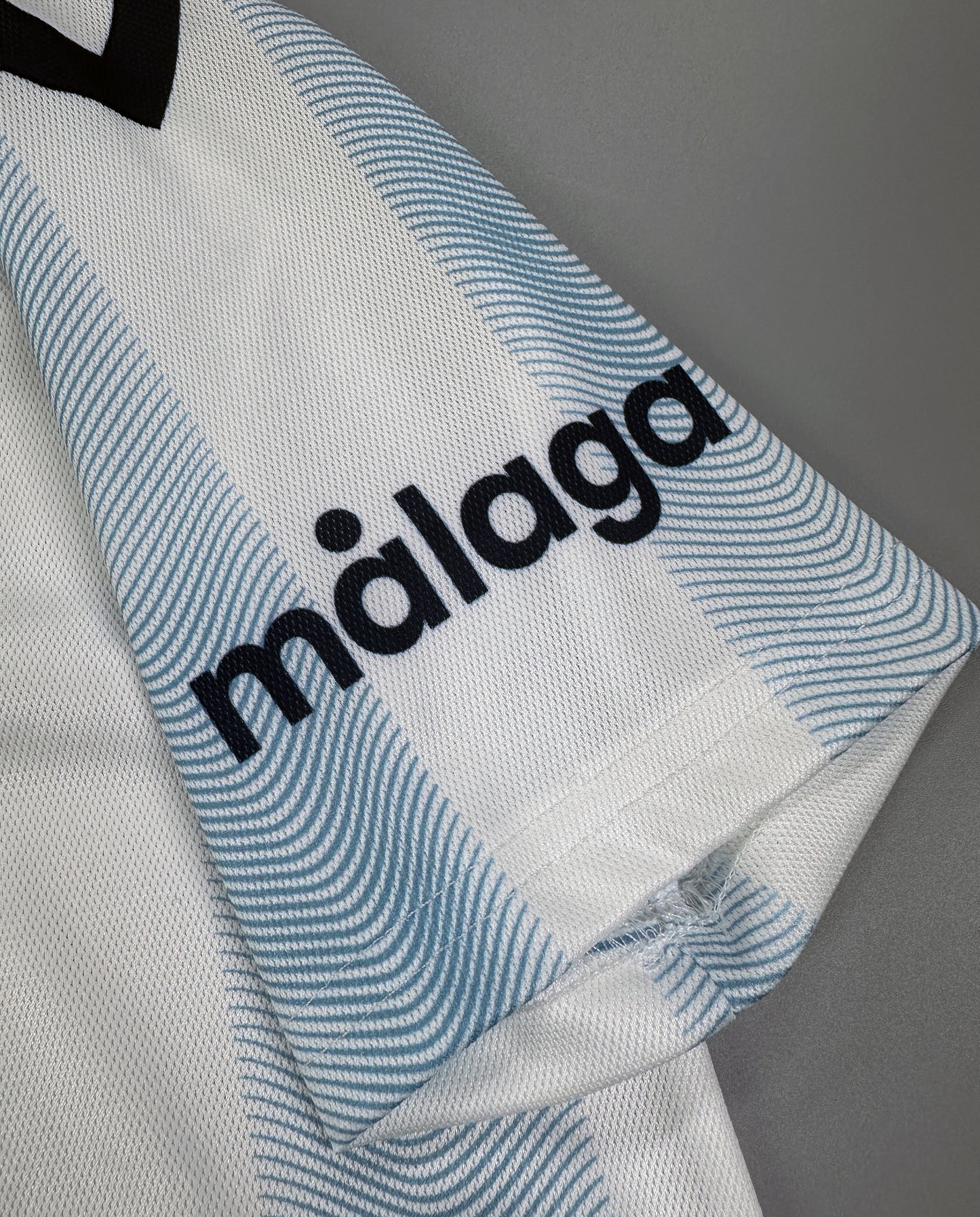 CAMISETA PRIMERA EQUIPACIÓN MÁLAGA 23/24 VERSIÓN INFANTIL