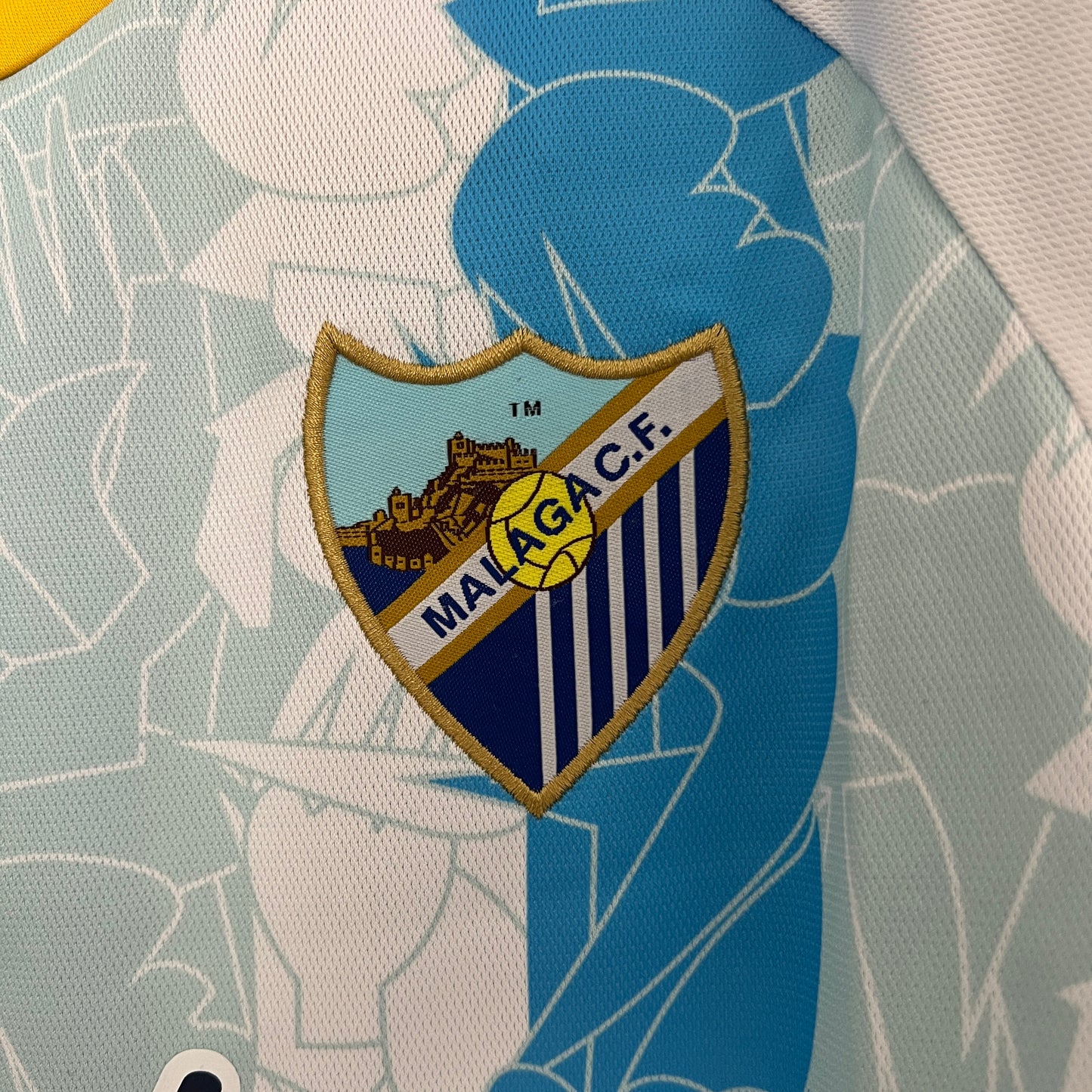 CAMISETA PRIMERA EQUIPACIÓN MÁLAGA 24/25 VERSIÓN FAN