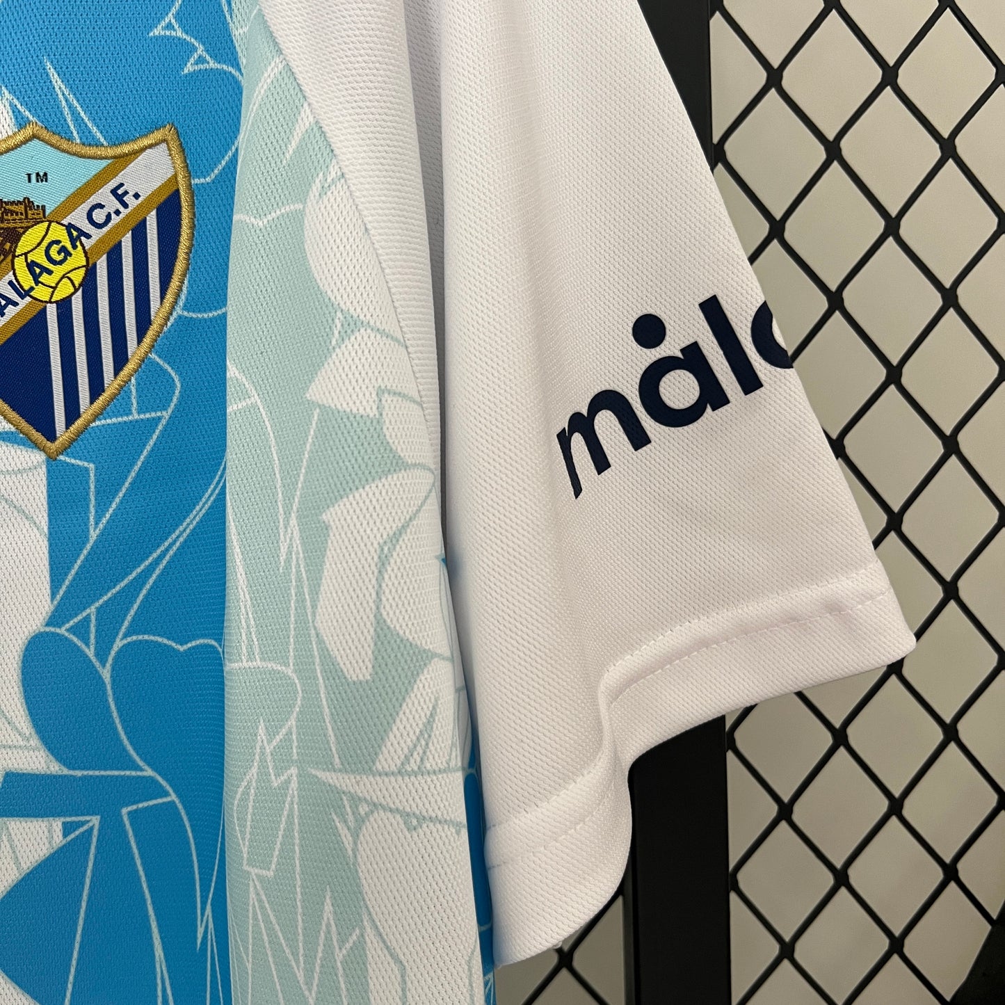 CAMISETA PRIMERA EQUIPACIÓN MÁLAGA 24/25 VERSIÓN FAN