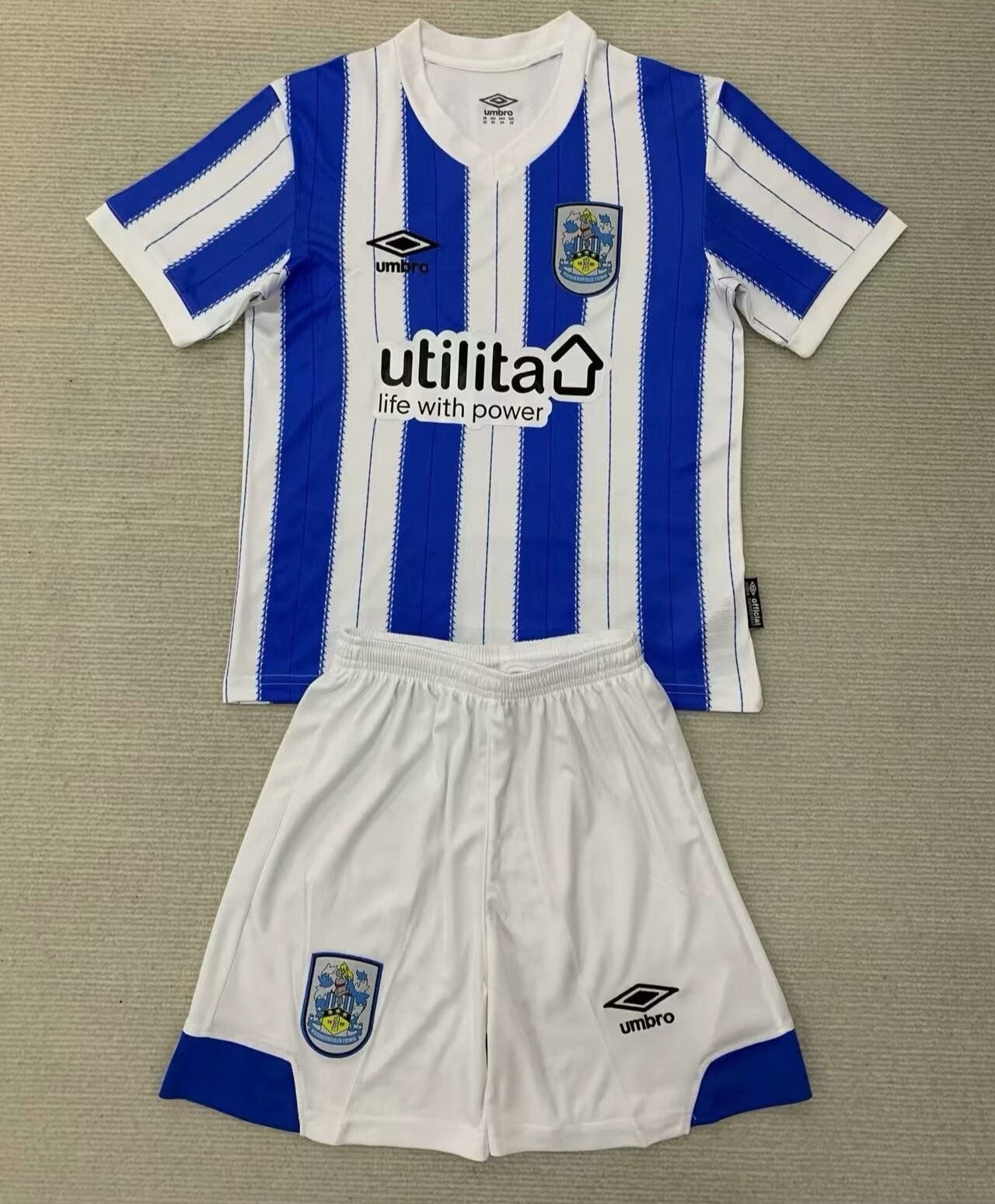 CAMISETA PRIMERA EQUIPACIÓN HUDDERSFIELD TOWN 24/25 VERSIÓN INFANTIL